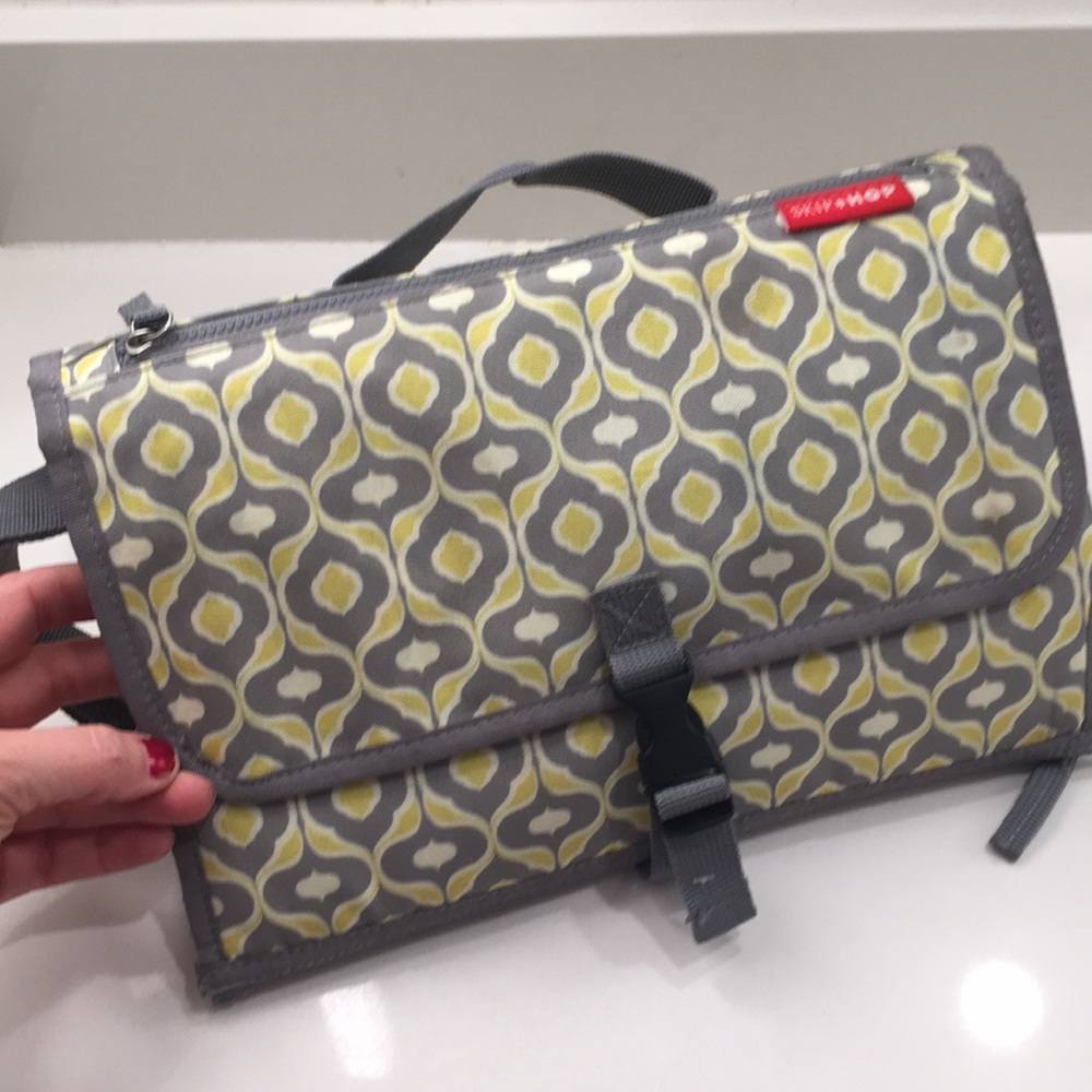 Diaper changing accessory and diaper bag accessory